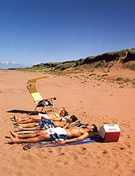 Dunes Beach House - sunbathing on beach